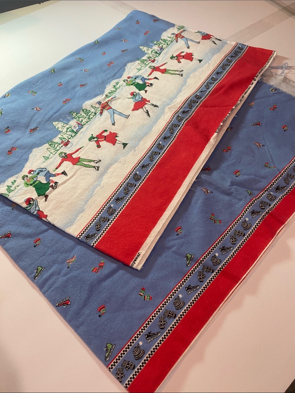 Holiday Ice Skaters Flannel Sewing Fabric - Blue, Red, White